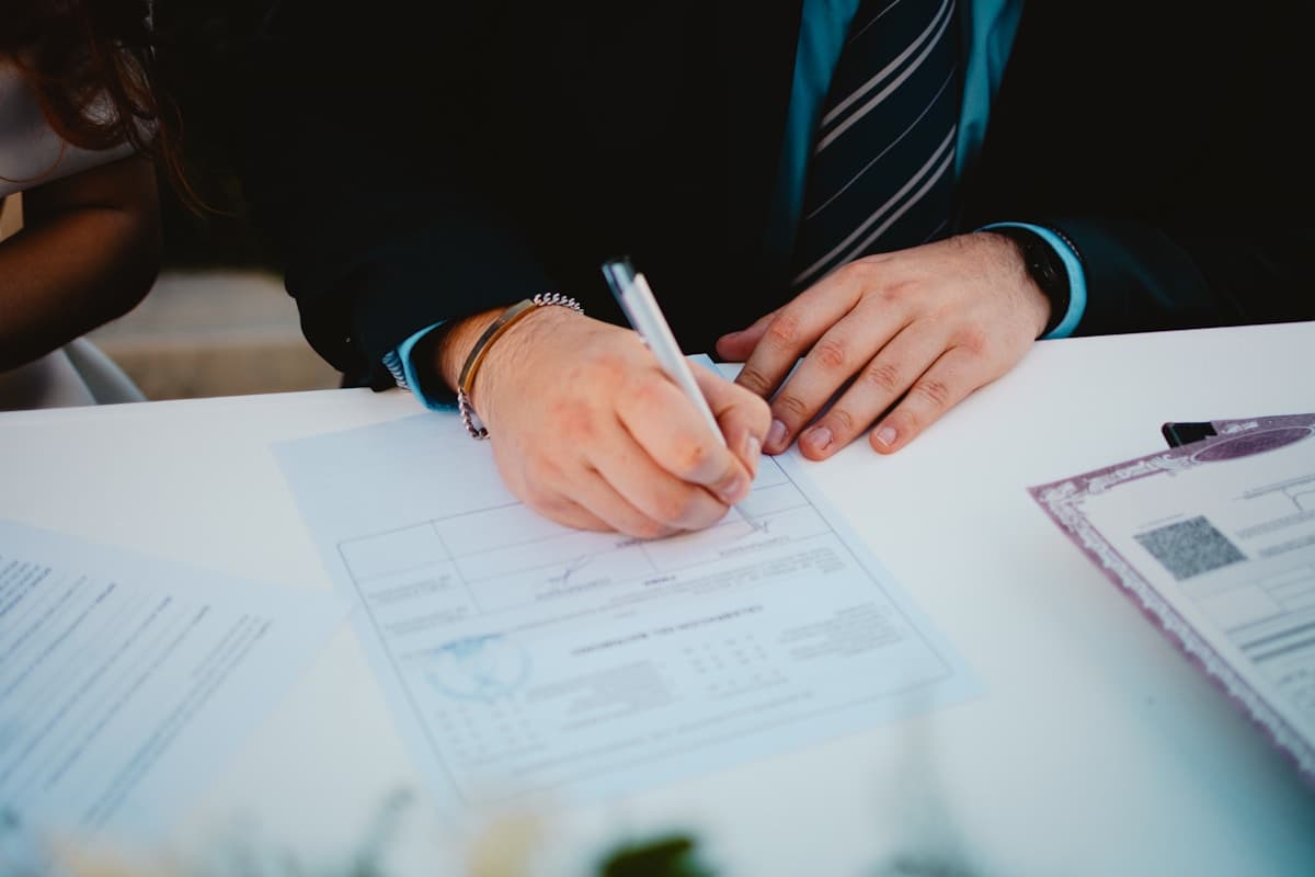 Professional completing renewal paperwork